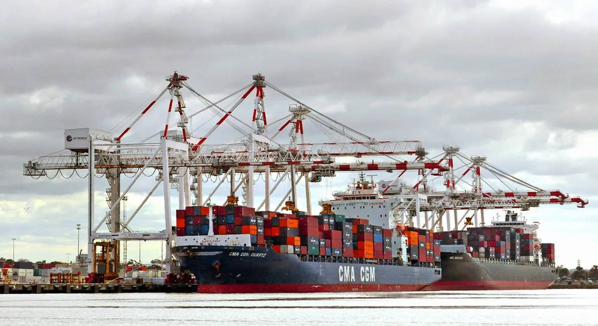 Container ship being loaded at a port terminal
